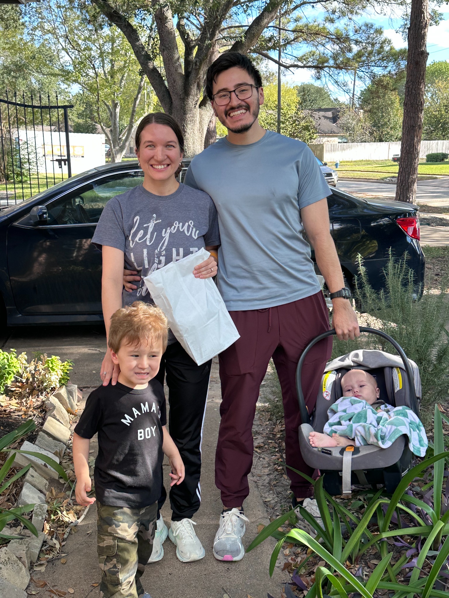 Edgar and his family outside their home on the day they returned from the hospital.